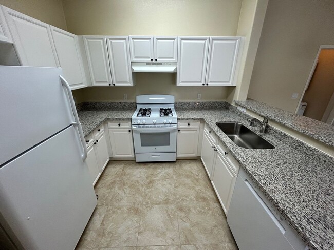 Building Photo - ADORABLE 2 BEDROOM 2 BATHROOM CONDO WITH A...