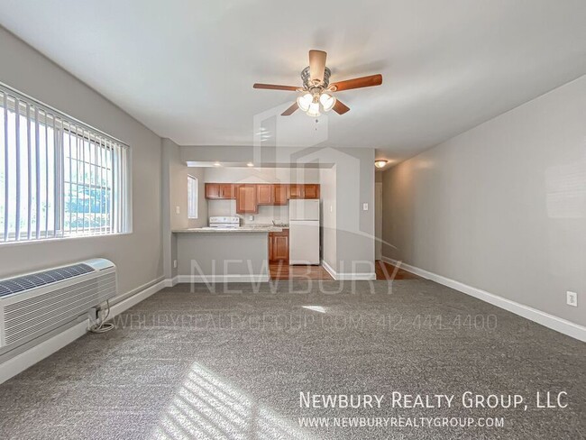 Building Photo - Modern One-Bedroom Apartment in Port Vue: ...