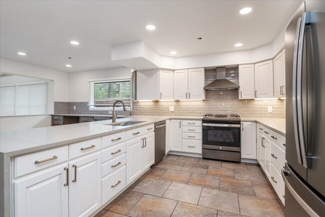 Kitchen featuring quartz counters and upgraded appliances - 1836 19th St House