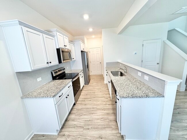 Building Photo - Three bedroom 2 1/2 bath paired home. Clos...