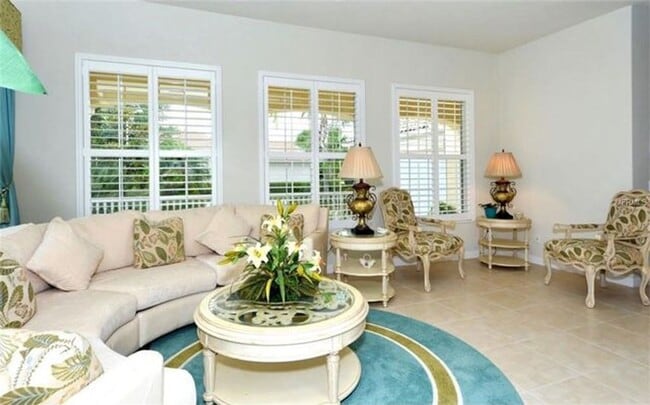 Building Photo - 4-bd, 4-bth in The Isles - One Of Palmer Ranch’s Most Sought After Community