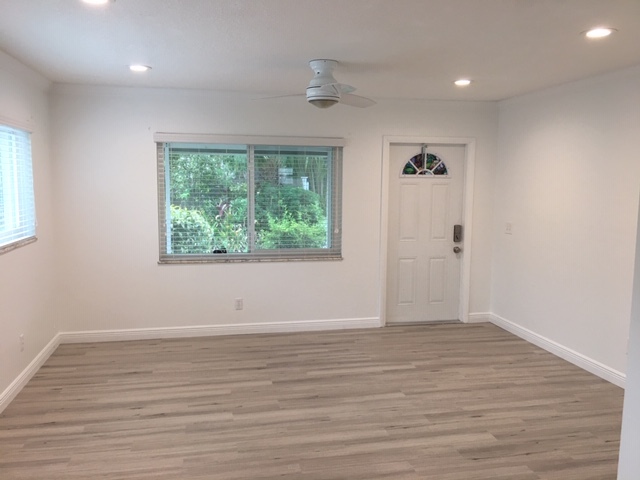 View from kitchen/dining area toward front window and door. - 514 SW 11th CT