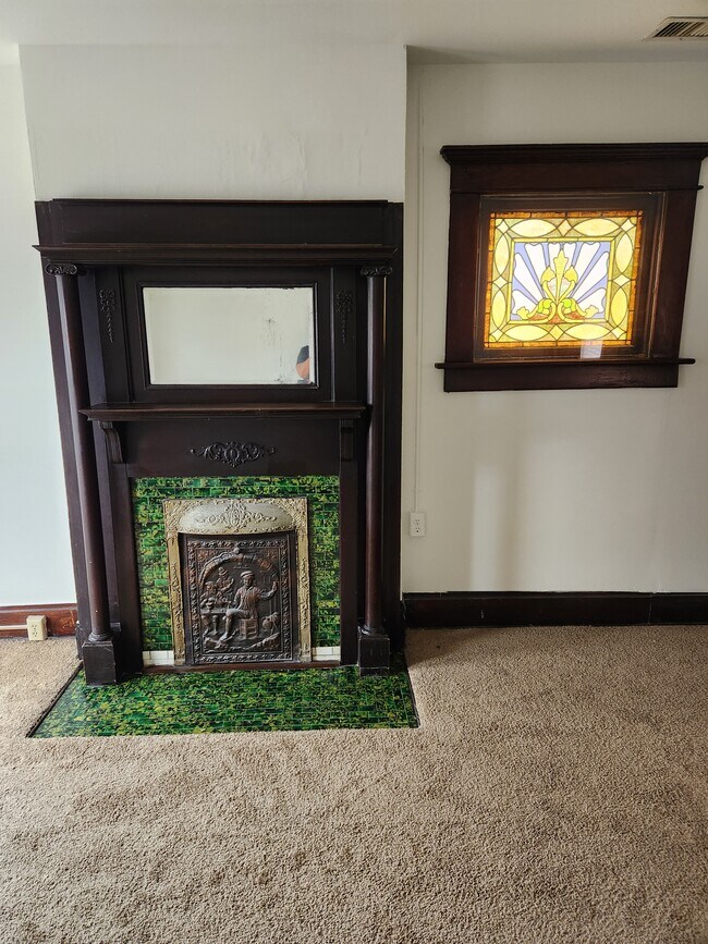 Original fireplace (non working) and stained glass window, original fireplace tile - 71 Martin Ave