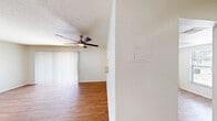 This 1060 square foot apartment offers a well-designed living space with three bedrooms and two bathrooms. The kitchen is a highlight, featuring honey-toned wooden cabinetry, stainless steel appliances, and ample counter space. The living area is open and bright, with large windows allowing natural light to flood the space.

Each bedroom is generously sized, with the primary bedroom measuring 170 square feet. The bathrooms are clean and modern, featuring white tile and wooden vanities. A standout feature is the in-unit laundry room, complete with full-sized washer and dryer.

Throughout the apartment, warm wood flooring creates a cohesive and inviting atmosphere. The property also includes three closets for added storage. The overall design is neutral and contemporary, allowing for easy personalization.

Located in the Summit West complex, unit 25F - C2 offers a comfortable and functional living space. The layout is efficient, maximizing the available square footage and creating a sense of openness. With its combination of practicality and style, this apartment is well-suited for those seeking a modern, low-maintenance home.