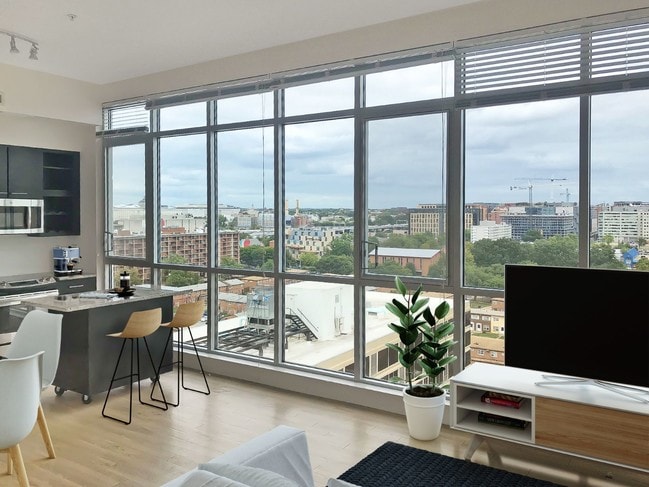 Kitchen and living area at Leo - Leo at Waterfront Apartments