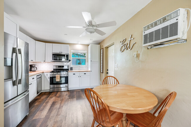 The wall mounted AC in this pic has since been removed and a large mirror is in its place. - 1236 Rosemary Ln