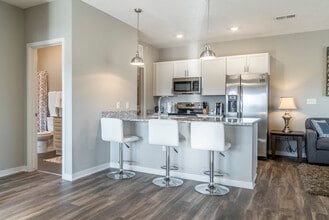 Modern kitchens offer stainless steel appliances and plenty of counter space for all your cooking needs. - The Villas at Mahoney Park