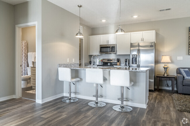 Modern kitchens offer stainless steel appliances and plenty of counter space for all your cooking needs. - The Villas at Mahoney Park