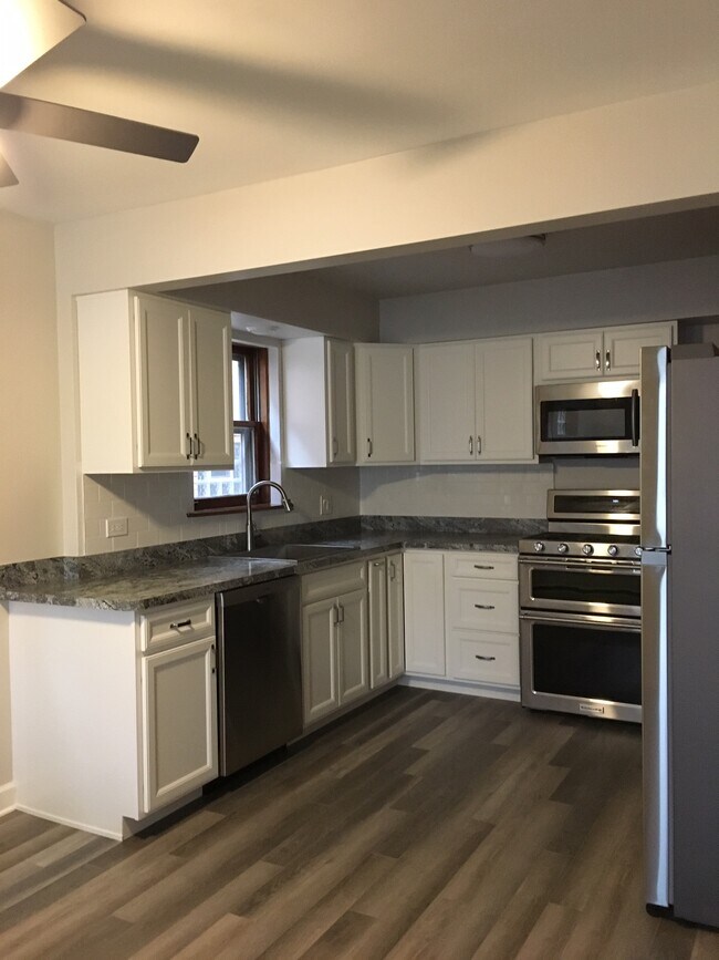 New kitchen - 5870 N Elston Ave Apartments