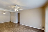 Located at 155 Mimosa Pl in Lafayette, Louisiana, this single-story 4-bedroom, 1-bathroom home offers a practical and comfortable layout. Wood-look flooring runs throughout the home, providing a cohesive and easy-to-maintain finish. Ceiling fans with integrated lighting are present in multiple rooms, supporting air circulation suited to the Louisiana climate.

The living room is bright and open, featuring a ceiling fan and a sliding glass door fitted with vertical blinds that allows natural light to pour in and provides direct access to the outdoors. The kitchen is efficiently arranged with warm oak-toned cabinetry, light countertops, a double-basin stainless steel sink, a dishwasher, and a coil-top electric range, offering ample storage and functional workspace. The four bedrooms are well-proportioned, each featuring ceiling fans and wood-look flooring; the primary bedroom includes a dedicated closet with a hanging rod and shelf. A hallway connects the rooms and provides access to the shared bathroom, which is fitted with a tiled tub-shower combination and standard fixtures. A dedicated closet offers additional storage. The home's neutral color palette and consistent finishes create a clean, move-in-ready atmosphere throughout.