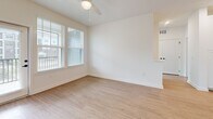 This 950-square-foot single-story residence in North Augusta, SC, features 2 bedrooms and 2 bathrooms with a clean, modern aesthetic carried consistently throughout. Light wood-look luxury vinyl plank flooring and crisp white walls create a bright, cohesive atmosphere across all rooms. The open kitchen is a standout, boasting white shaker cabinetry with matte black hardware, quartz countertops, a subway tile backsplash, a central island with an undermount sink, and a full suite of stainless steel appliances. The combined kitchen and living area provides an efficient, open-concept layout ideal for everyday living. The primary bedroom spans 150 square feet and is served by a well-appointed bathroom featuring a double-sink vanity with white cabinetry, quartz countertops, and matte black fixtures. A dedicated closet with wire shelving provides organized storage. The second bedroom offers natural light through large windows with views of the surrounding community. The second bathroom includes a tub-shower combo with tiled surround, built-in shelving, and matching modern fixtures. Ceiling fans in the main living areas and recessed lighting in the kitchen enhance both comfort and functionality throughout this well-finished home.