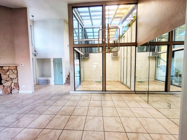 Open living space with dining area overlooking the atrium - 45390 Driftwood Dr