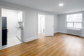 Located at 262 Jarvis St, Suite 608 in downtown Toronto, this one-bedroom, one-bathroom unit offers a practical and well-appointed layout across a single floor. The spacious bedroom is the heart of the unit, featuring warm hardwood-style flooring, clean white walls, and a window with city views that allows natural light to fill the room. A classic radiator provides in-unit heating, adding a touch of traditional character. Recessed ceiling lighting throughout lends a clean, modern finish.

The bathroom is bright and fully tiled in white, featuring a soaker tub and shower combo with a curved curtain rod, a toilet, and a radiator for warmth. A small window provides natural ventilation and additional light, keeping the space feeling fresh and open.

The kitchen is compact and efficiently designed, equipped with a stainless steel gas range and a full-size refrigerator, set against white walls and light tile flooring. The unit also includes a dedicated closet for storage. Clean lines, neutral tones, and updated finishes throughout give the space a move-in-ready feel, making it a functional and comfortable option in the heart of Toronto's downtown core.