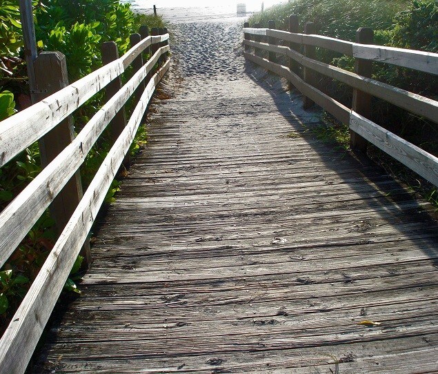A sandy boardwalk to the beach