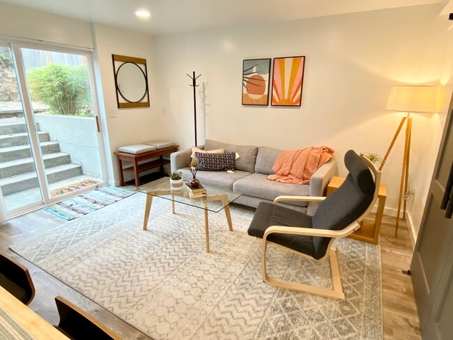 Living room with high ceilings. - 4045 54th Ave SW
