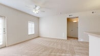 This single-story, one-bedroom, one-bathroom home in Shreveport, Louisiana offers a practical and well-designed layout across a comfortable floor plan. The open living area is carpeted and bathed in natural light from a window, with a ceiling fan overhead providing year-round comfort. Neutral, warm-toned walls throughout create a clean and inviting atmosphere.

The galley-style kitchen features wood-look flooring, light wood cabinetry, a full suite of white appliances including a refrigerator, electric range, microwave, and dishwasher, along with a breakfast bar that opens toward the living area. The kitchen connects through a hallway, offering easy flow to the rest of the home.

The generously sized bedroom features plush carpet, a ceiling fan with light, and a window that allows natural light to fill the space. It provides ample room for furnishings and comfortable living.

The bathroom is finished with wood-look flooring and includes a tub-shower combination, toilet, and a vanity with storage. The dedicated laundry room features wood-look flooring, wire shelving, and includes a washer, making everyday tasks convenient. A separate closet provides additional storage. This home offers a streamlined and functional living experience suited for those seeking comfort and practicality.
