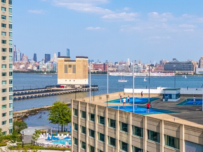 Challenge your friends to a game of pickleball in a vibrant outdoor setting - Newport Rentals