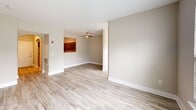 Located at 270 Brandywine Dr in Bear, Delaware, this single-floor, one-bedroom, one-bathroom residence offers a thoughtfully designed layout with a clean, modern aesthetic. An arched entryway hallway with light wood-style flooring welcomes you in, setting the tone for the rest of the home.

The kitchen is a standout feature, showcasing rich dark espresso cabinetry with sleek hardware, white quartz countertops, a gray subway tile backsplash, and a full suite of stainless steel appliances including a refrigerator, range, built-in microwave, and dishwasher. The U-shaped layout maximizes both storage and workspace efficiency.

The open living and dining area is bright and inviting, featuring the same light wood-style flooring, neutral warm-toned walls, and a ceiling fan. A pass-through connects to the kitchen area, enhancing the open feel of the shared living space.

The bedroom is a comfortable and quiet retreat, carpeted for warmth, with large windows that allow natural light to fill the room. A dedicated closet adds practical storage.

The bathroom is well-appointed with a dark vanity cabinet paired with a white countertop, a tub-shower combination featuring a striking mosaic tile surround in muted earth tones, and wood-look tile flooring. A louvered closet door adds a classic touch to the space.