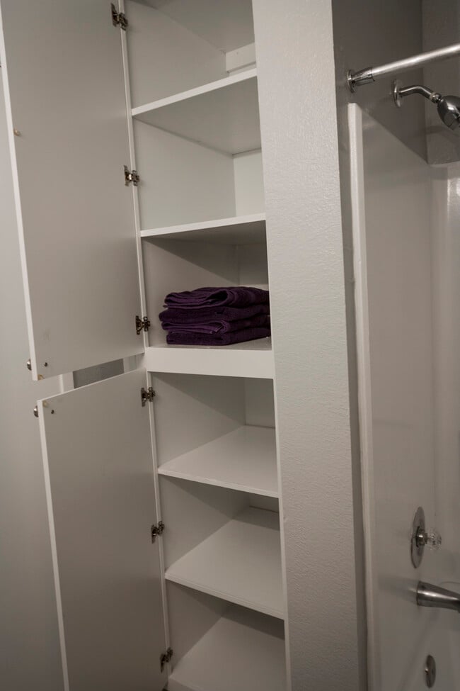 Linen closet storage in bathroom - Arbor Pointe Apartments