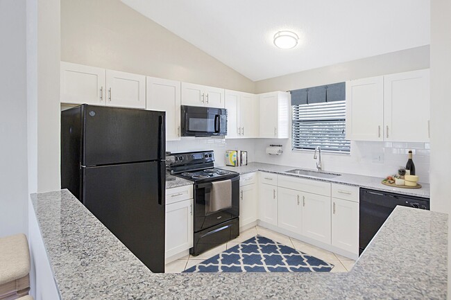 Crown Court/Dunes of Boca- White Kitchen - Lilac Village Boca Raton Apartments
