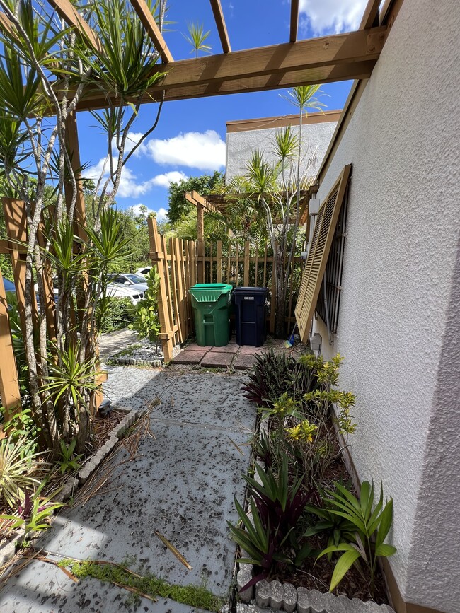 Hidden storage area for garbage and recycle bins - 1424 SW 131st Place Cir E