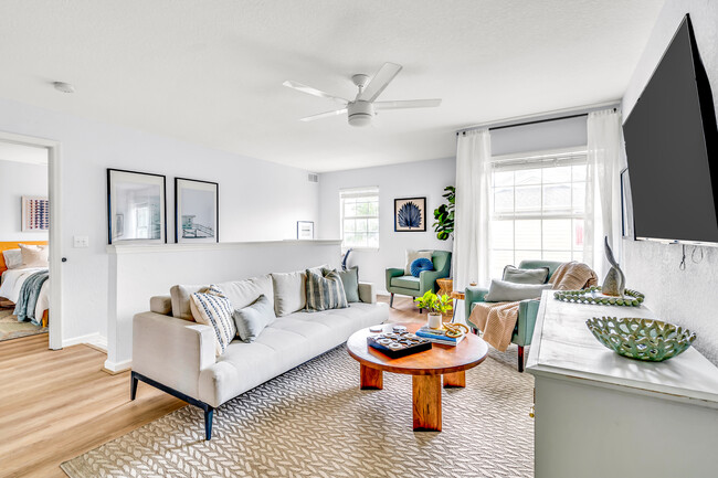 Natural light floods the living area complimenting the island vibe decor - 4850 51st St W