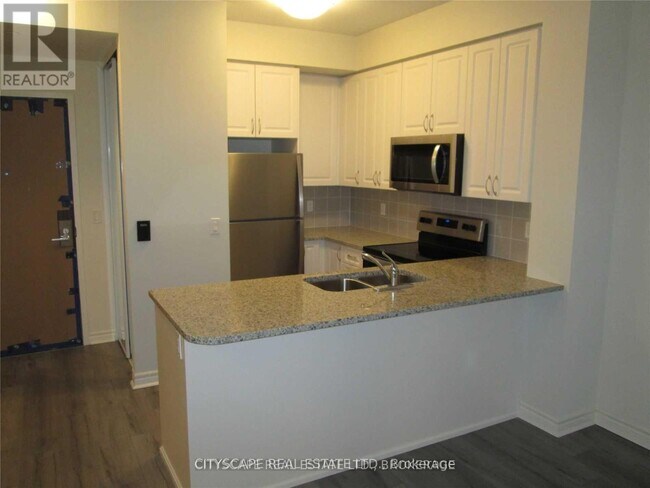 Photo du bâtiment - 349-1349 Rathburn Rd W