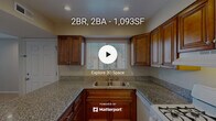 Located in Temecula, CA, this single-floor, 2-bedroom, 2-bathroom home offers a practical and comfortable layout designed for everyday living. The kitchen serves as a functional centerpiece, showcasing rich, warm-toned wood cabinetry, granite countertops, a double-basin sink beneath a natural light-admitting window, and a peninsula that provides additional prep space and a natural transition into the living area. White appliances, including a gas range, dishwasher, and refrigerator, complete the kitchen setup. Recessed lighting illuminates the space throughout. The living room is generously proportioned with plush carpet flooring and vertical blinds covering a large window, allowing for adjustable natural light. The primary bedroom is a well-sized retreat featuring multiple windows that bring in ample natural light, carpet flooring, and access to closet storage. The second bedroom is comparably comfortable with neutral tones and carpeting. Both bathrooms are clean and functional, with one featuring a full tub-shower combination. A hallway connects the rooms efficiently, and three closets provide abundant storage throughout the home. Hardwood-style flooring in the kitchen and entry areas adds a warm visual contrast to the carpeted living spaces.