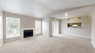Located in Houston's 77083 zip code, this single-story, 3-bedroom, 5-bathroom home offers a well-organized layout designed for comfortable living. The open living room is a standout, featuring vaulted ceilings that lend a sense of spaciousness, soft neutral carpet, a classic fireplace, and a sliding glass door that invites natural light throughout. A pass-through opening connects the living area to the kitchen, creating a cohesive and social floor plan. The kitchen is appointed with granite countertops, ample cabinetry, and elegant marble-style tile flooring, complemented by a bright window overlooking the outdoors. The bathrooms echo the kitchen's refined finishes, with matching granite vanity tops, marble-style tile floors, and clean white fixtures including a full soaking tub. Each of the three bedrooms is carpeted and features generous closet space — including walk-in closets with wire shelving systems and sliding-door closets — providing practical storage throughout. Hallways connect the rooms efficiently across the single floor. The home's consistent neutral palette, warm carpet tones, and cohesive finishes create a calm, functional living environment suited for a variety of lifestyles.