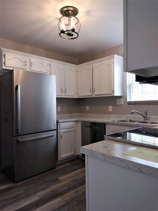 Building Photo - You'll Love the Modern Upgrades in this Fu...