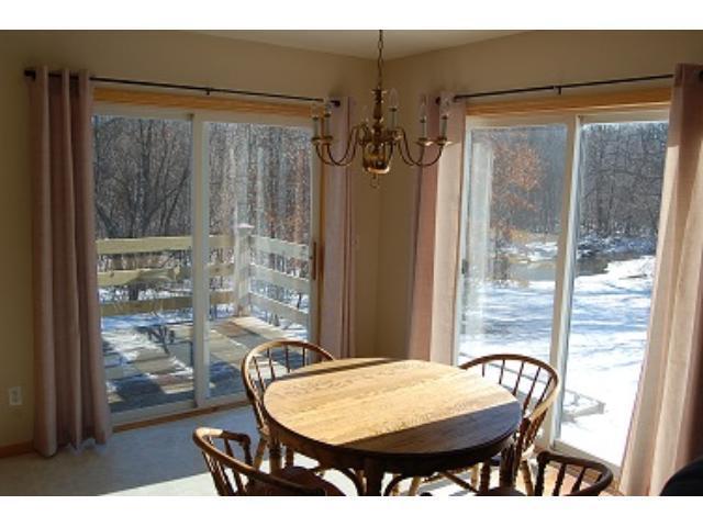 Dining room overlooking the woods and river - 10795 Wilcox Rd