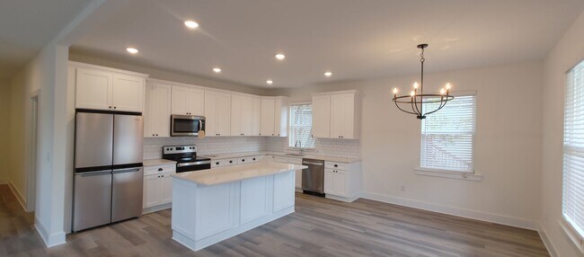 Building Photo - 5-bedroom home with 3 car garage and fully...