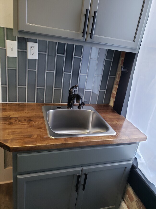 All new kitchen cabinets, countertops. sink, tiled backsplash - 406 High St