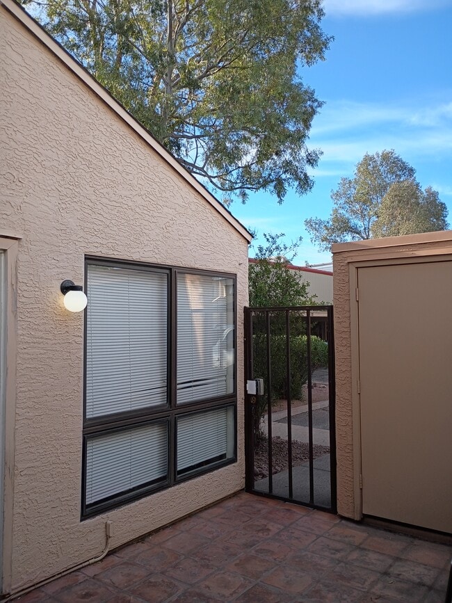Gated entrance storage area living room window - 7618 E Callisto Cir