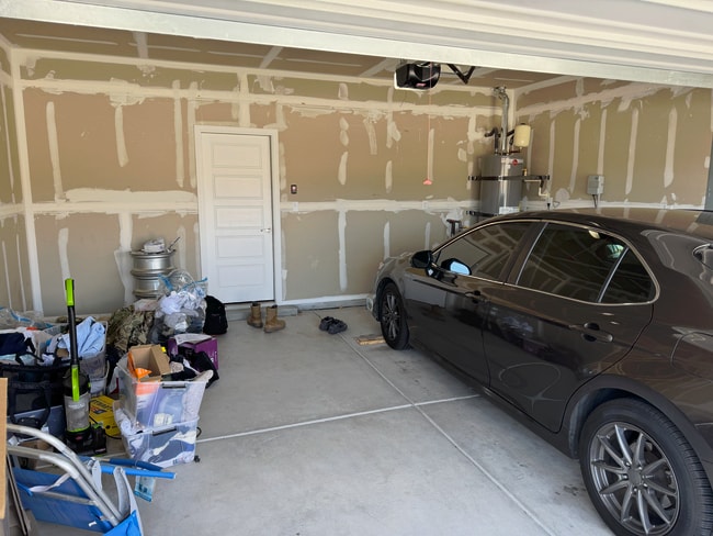 Attic entry behind garage motor. - 2818 Cambridge Ave NE
