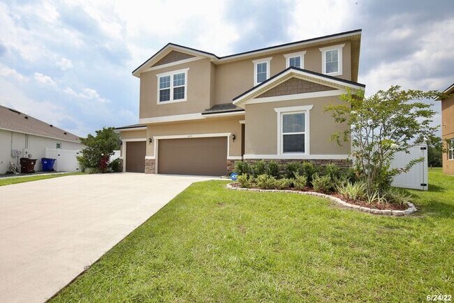 Building Photo - GORGEOUS 4/2.5 Two-Story home with Fenced ...