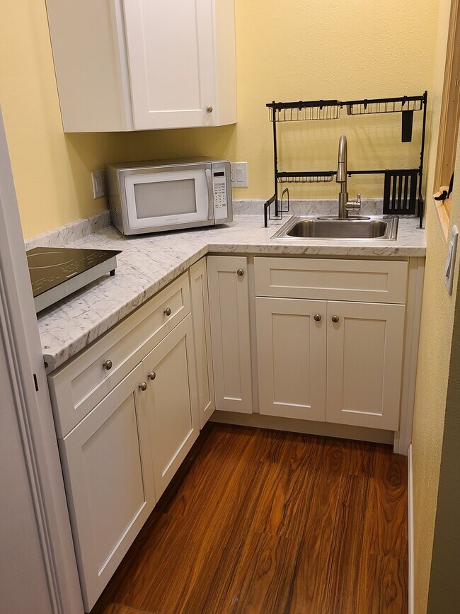 Kitchenette has Electric Stove and New LG Refrigerator - 12881 Eveningside Dr