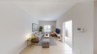 Located at 4761 SW 47th Ct in Dania Beach, Florida, this furnished two-floor residence offers a thoughtfully designed layout with a clean, contemporary aesthetic throughout. The main level features a bright and airy living room finished with light tile flooring, neutral walls, and ample natural light from a front-facing window. A door opens directly to a private paved outdoor area, seamlessly connecting indoor and outdoor living. Adjacent to the living space is a dedicated sitting room with a tray ceiling, warm leather accent chairs, and tasteful coastal artwork — an ideal retreat for relaxation or conversation. The well-appointed kitchen stands out with white shaker cabinetry, classic subway tile backsplash, stainless steel appliances, and generous countertop space. A separate dining area features a tray ceiling and large sliding glass doors that open to a private balcony overlooking lush greenery, creating a serene setting for meals. A half bathroom on the main level adds everyday convenience, featuring a pedestal sink and clean finishes. Upstairs, the bedroom offers warm wood-look flooring, a ceiling fan, abundant natural light, and a calm, restful atmosphere. The floorplan model reveals a well-organized upper level with multiple rooms and a staircase connecting both floors, rounding out this comfortable and functional Dania Beach residence.