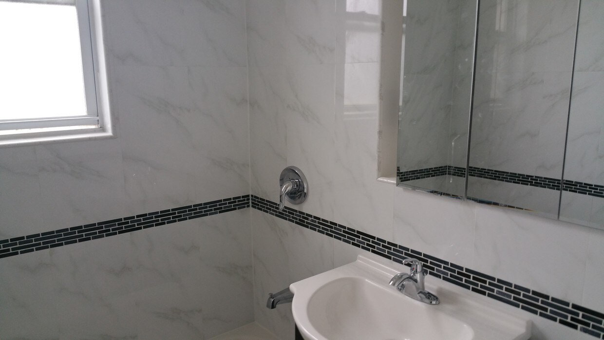 Renovated bathroom - 30-08 83rd St
