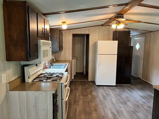 Kitchen with adjacent laundry room - 746 Pony Farm Rd