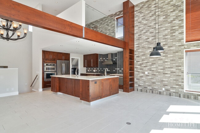 Building Photo - Spacious Executive 5 Bedroom Home with Water Views & Beautiful Outdoor Space