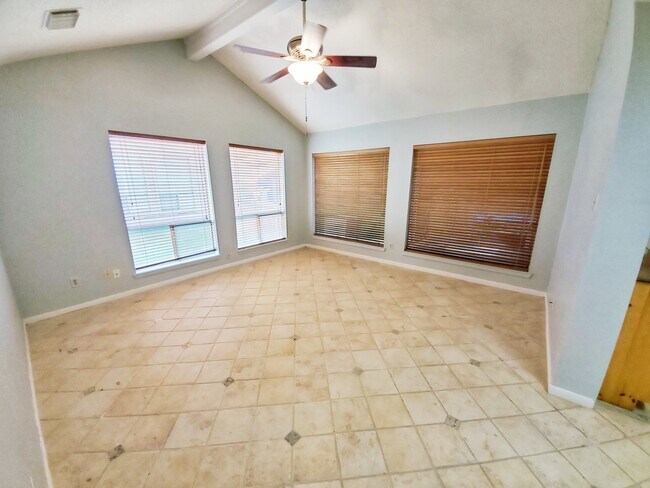 Living room has large windows and vaulted ceiling - 14 Townhouse Ln