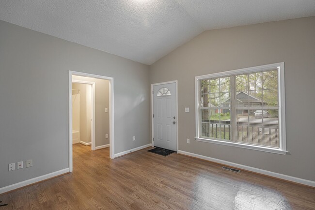 Building Photo - Like New Home off Freeman Mill.  Just Painted, New Wood/Vinyl Flooring, Vaulted Ceilings, Front P...