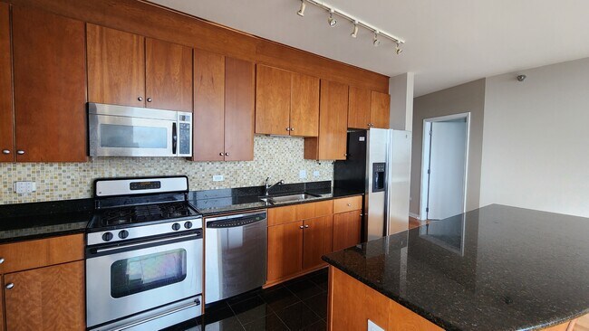 Kitchen with Stainless Steel Appliances - 33 W Ontario St