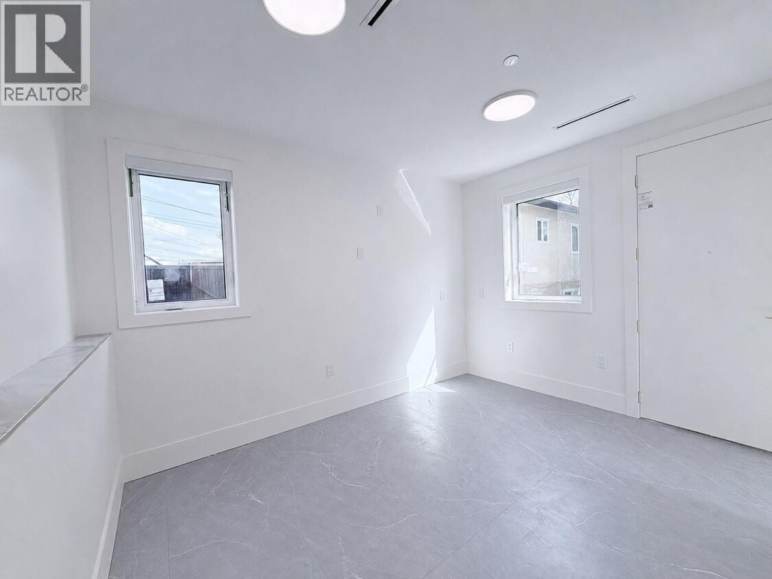 Building Photo - 10XX E 62nd Ave
