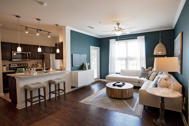 Living and dining areas with hard surface flooring throughout - Avalon Frisco at Main