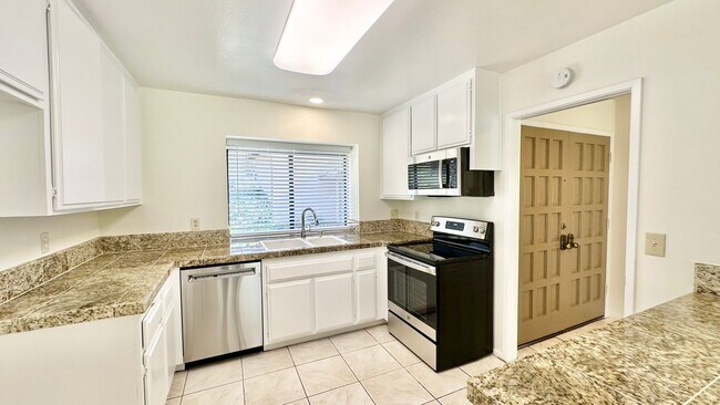 Building Photo - Sweet Walk-up, Ground Level Condo Unit in ...