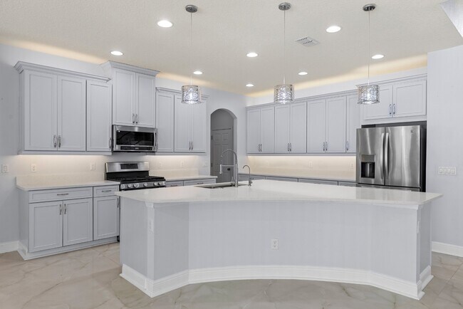 Foto del edificio - Spacious 6-Bedroom Home Near Lake Nona | 3-Car Garage + Tesla Charger