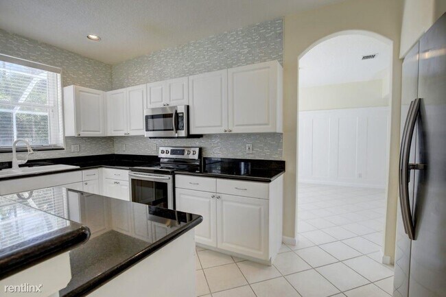 Foto del edificio - 4 br, 2.5 bath House - 7715 Colony Lake Dr