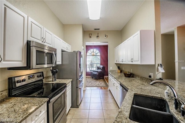 Building Photo - 4 br, 3 bath House - 9911 Alafia River Ln